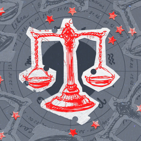 Paper cutouts of the Libra zodiac on a gray background