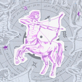 Paper cutouts of the Sagittarius zodiac on a gray background