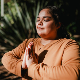 Woman meditating in park